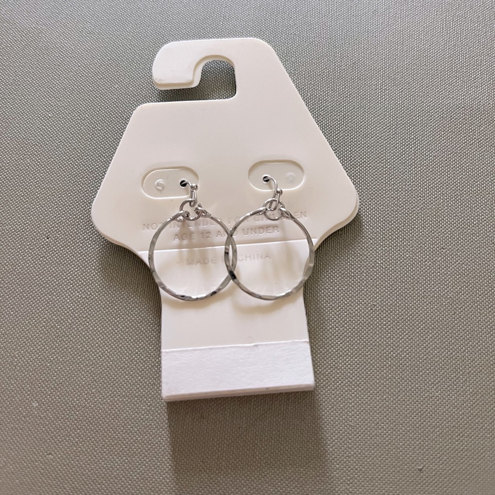 Twisted sterling silver hoop earrings.